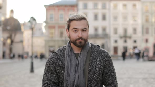 Portrait Bearded Happy Man Who is Turning His Head and Looking at the Camera