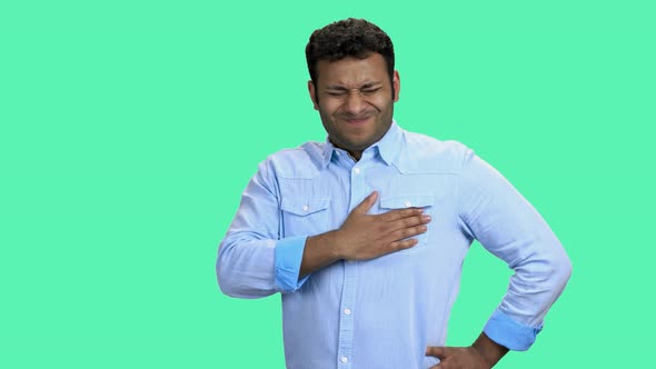 Man Having Chest Pain on Color Background