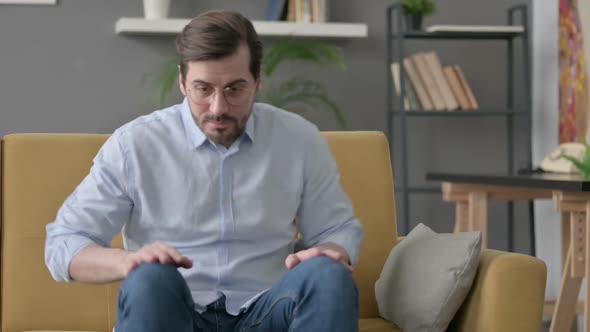 Young Man Standing Up Going Away Leaving Sofa