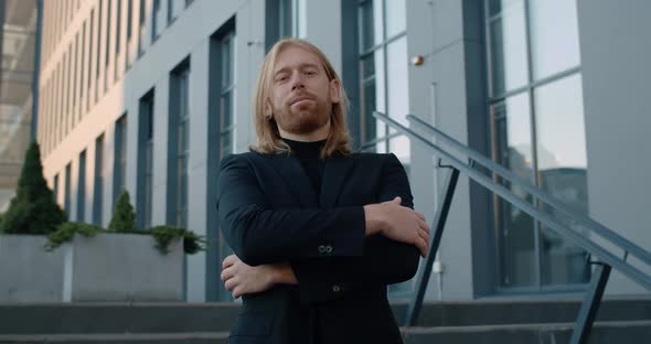 Portrait of Bearded Man in Suit Crossing Arms and Looking To Camera. Crop View of Successful Ceo