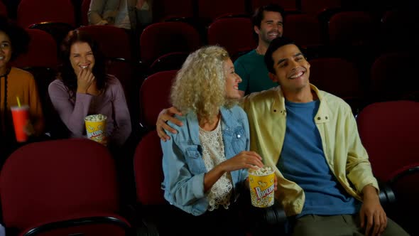 Couple watching movie in theater 4k