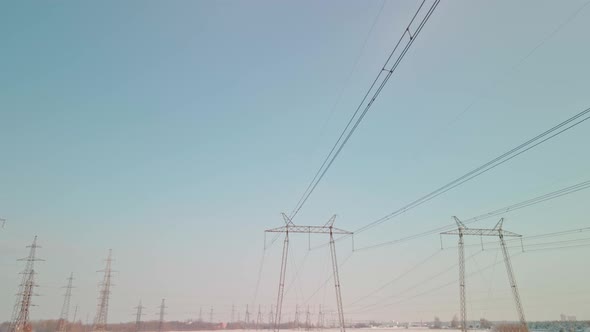 Power Pylons in a Field in Winter