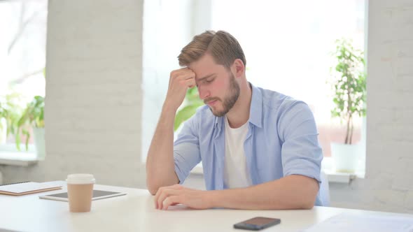 Creative Man Thinking Feeling Worried in Modern Office