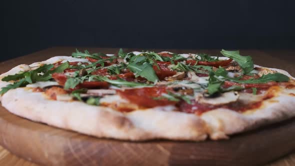 Appetizing Pizza on a Wooden Board in a Restaurant