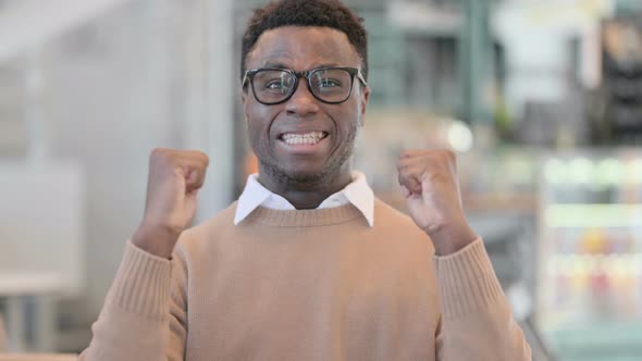 Excited Creative African Man Celebrating Success