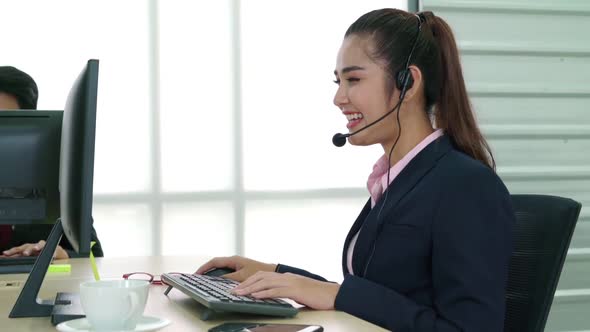 Business People Wearing Headset Working in Office