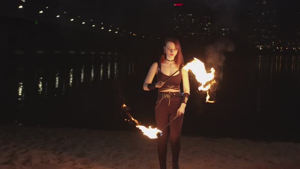 Fireshow Artist Performing Work with Lit Torches