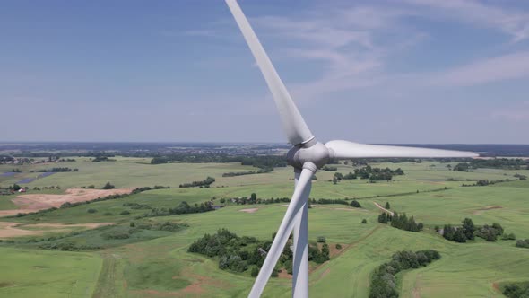 Aerial view of windmills farm for energy production on beautiful cloudy sky at highland. Wind power 