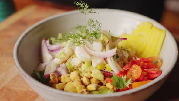 Cinematic close up shot of delicious peruvian seafood salad, ceviche starter dish with heathy and co