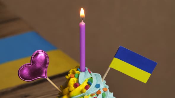 Cupcake with Ukrainian Flag for Birthday with Candles and Decorations