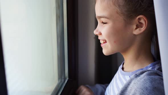 Happy Teen Girl Removes Protective Mask Look Out of Window Outside