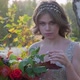 A Young Woman Dressed in a Gray Wedding Dress Celebrates Her Wedding. She Has Flowers in Her Hand - VideoHive Item for Sale