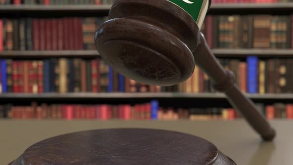Flag of Pakistan on Falling Judges Gavel in Court