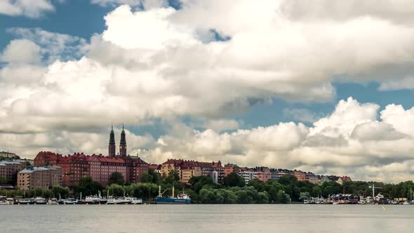 View From the Bay To Stockholm, Sweden. Running Clouds in the Sky on a Summer Day. Time Lapse Zoom