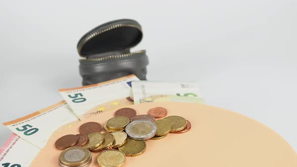 Euro bills and coins. Cash. The concept of savings.