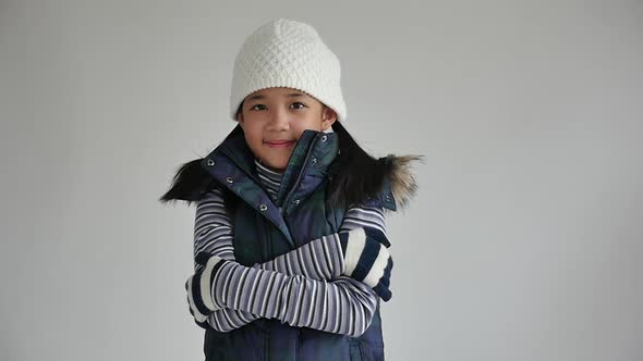 Cute Asian Girl In Winter Clothes On Gray Background Isolated Slow Motion