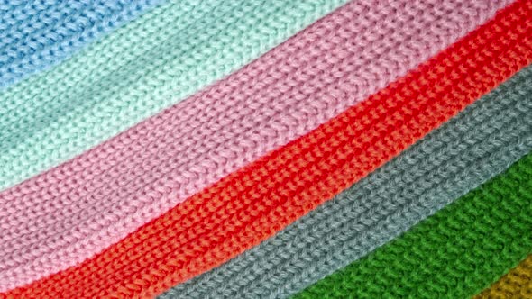 Multiple Loops of Yarn on Colorful Fabrics  Slow Pan Footage. Abstract Background