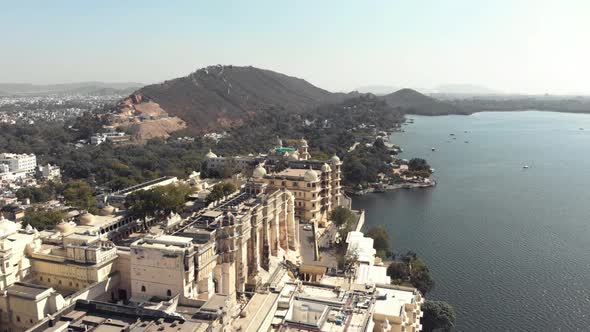 Drone footage of the lakeshore Shiv Temple in the city of Udaipur, India just off of Lake Pichola