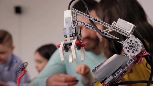 Closeup of Programmed Robot Assembled From Plastic Parts of a Construction Kit