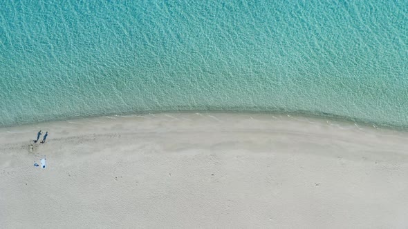 Aerial pull out view of a sandy beach