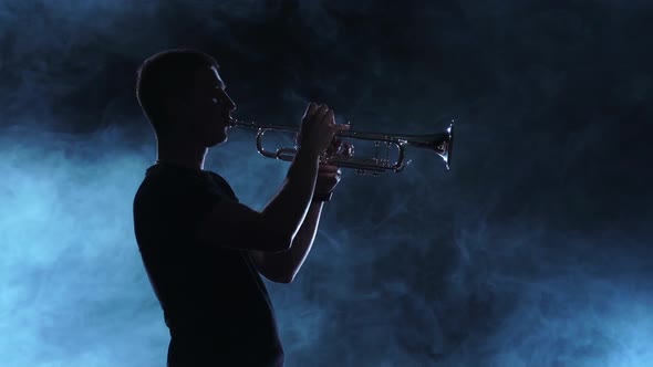 Professional Musician Man Playing on Trumpet, Smoky Silhouette, Slow Motion