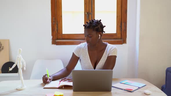 Black woman working remotely at home