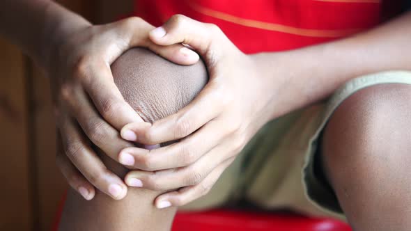 Close Up Child Boy Suffering Knee Joint Pain