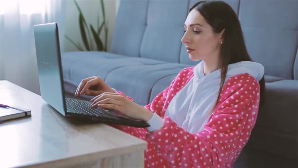 Young Woman in Funny Pajama Working From Home