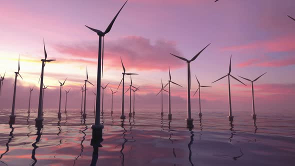 Wind farms in the sea at a beautiful pink sunset