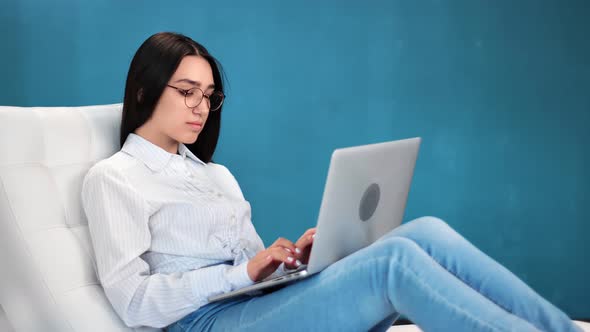 Focused Business Female in Trendy Glasses Chatting Use Laptop