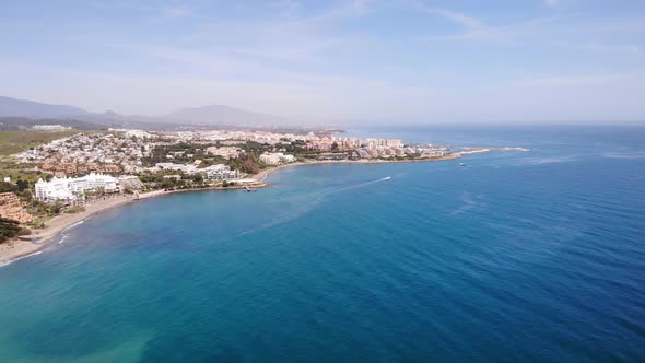 Aerial Dolly Over Turquoise Waters Of The Alboran Sea With Estepona Coastline In View