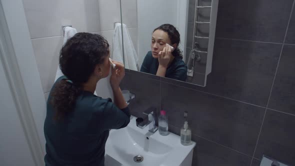 Black Woman Cleaning Face With Cosmetic Cotton Pad Removing Makeup