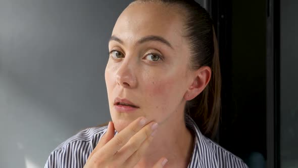 Beautiful Woman Touching Face