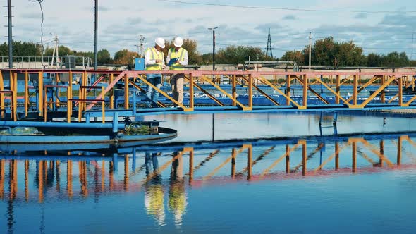 Workers Are Analyzing Samples of the Wastewaters