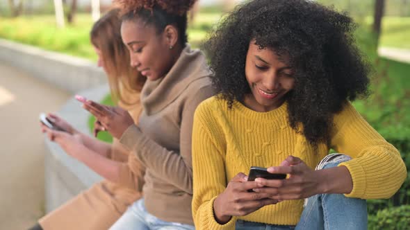 woman is leafing through a social network or looking at photos on her phone