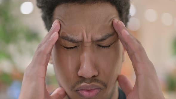 Close Up of Face of African American Man Having Headache