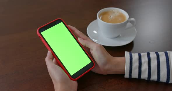 Woman watch on cellphone with chroma key