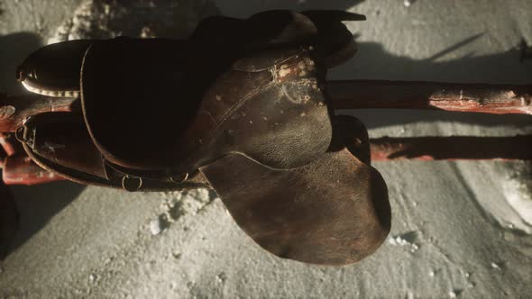 Rider Leather Saddle on Fence in Desert