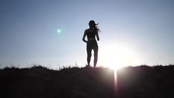 Silhouette woman running win