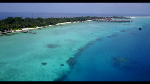 Aerial drone shot texture of relaxing coastline beach voyage by shallow sea and clean sandy backgrou