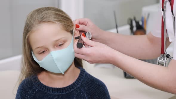 Little Boy Having an Ear Examination at Pedeatrician's