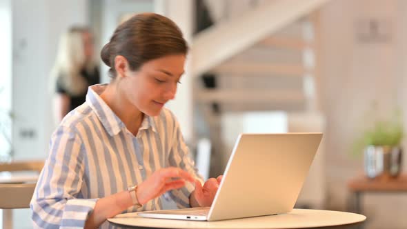 Indian Woman Coming Back and Working on Laptop 