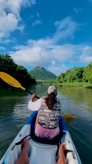 Mauritius Vacation Couple Man and Woman in Kayak in a Bleu Ocean in Mauritus