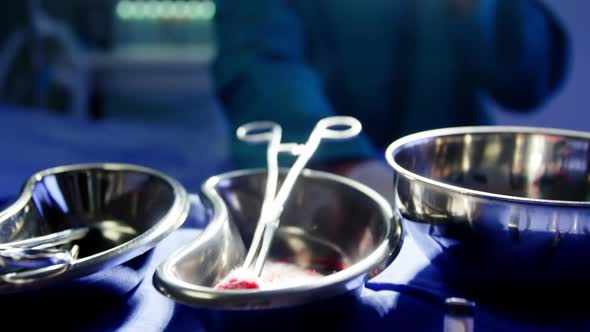 Tensed male surgeon sitting in operating room