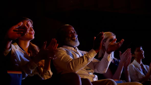 Multi-ethnic business people applauding in business seminar at auditorium 4k