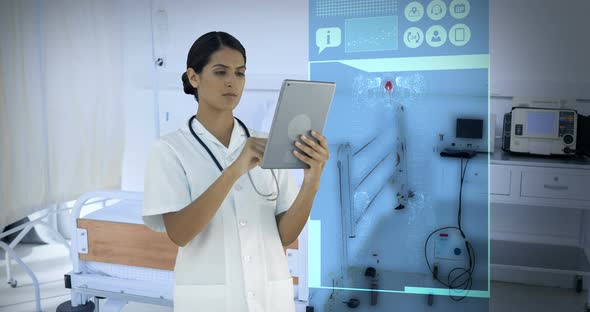 Doctor looking at digitally generated medical icons on tablet