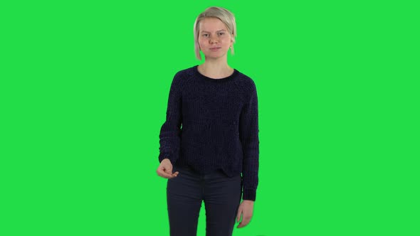 Blonde Girl with Creative Haircut Is Outragedly Talking To Someone on a Green Screen