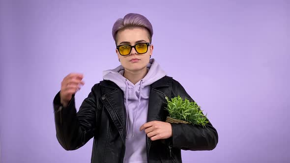 Lesbian Holding Potted Plant Lowering Eyeglasses Looking at Camera