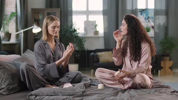 Female Friends Doing Beauty Routine Together
