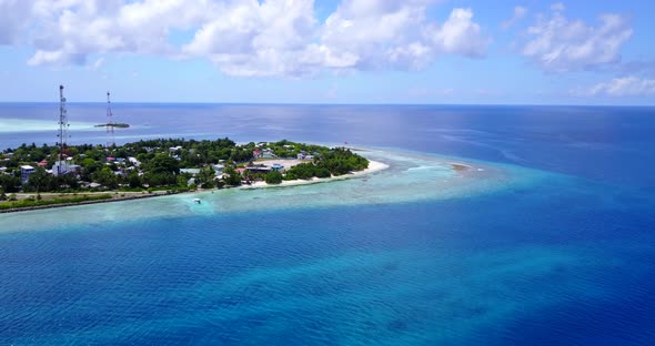 Natural fly over tourism shot of a sunshine white sandy paradise beach and blue sea background in co